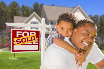 Mixed Race Father and Son In Front of Real Estate Sign and House