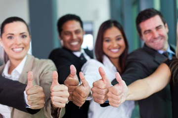 business group giving thumbs up