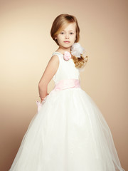 Portrait of little girl in luxurious dress