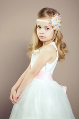 Portrait of little girl in luxurious dress