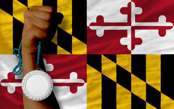Silver medal for sport and flag of american state of maryland