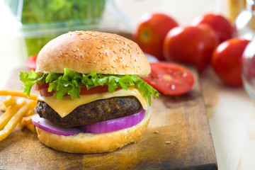 hamburger fast food with plenty of raw materials on the backgrou