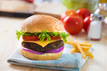 hamburger fast food with plenty of raw materials on the backgrou