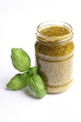 Glass wih basil pesto , fresh basil.