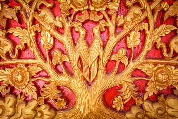 Pattern of animal and tree carved