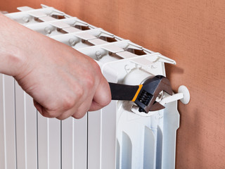 adjusting heating radiator