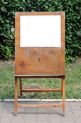 a blank painter easel over green background