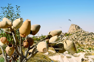 Pottery  tree in front of Uchisar Castle in Cappadocia, Turkey
