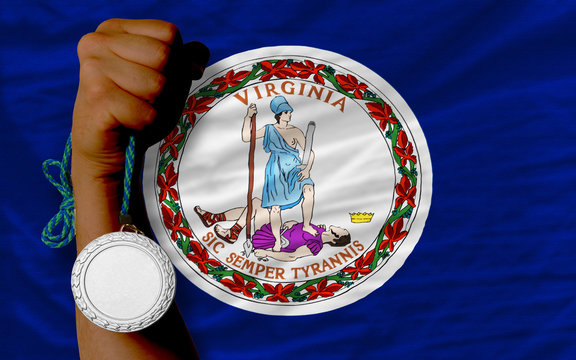 Silver medal for sport and flag of american state of virginia