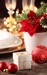 Little gift and wine glass on holiday table