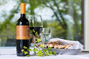 Red wine with bottle and glass on a table