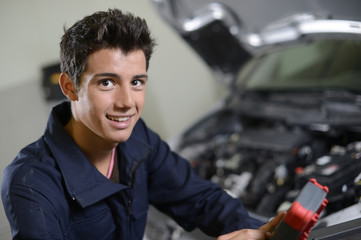 Portrait of student in auto mechanics - obrazy, fototapety, plakaty