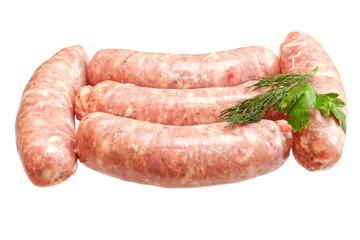 Raw meat sausages with greens isolated on white background