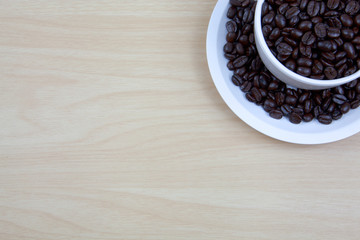 Cup of coffee on a wooden surface