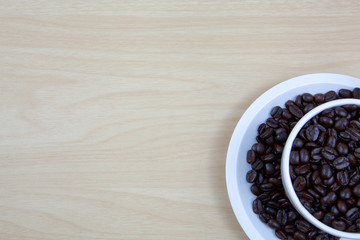 Cup of coffee on a wooden surface