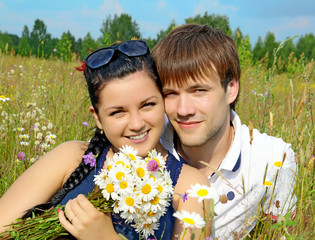 Young happy couple in nature