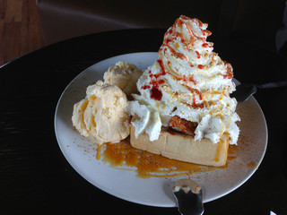 Ice cream and honey toast with whip cream and cinnamon
