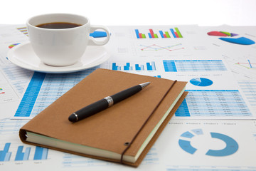 Business report with cup of coffee