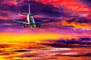 passenger aircraft on colorful sky