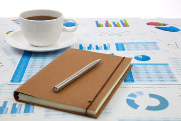 Business report with cup of coffee