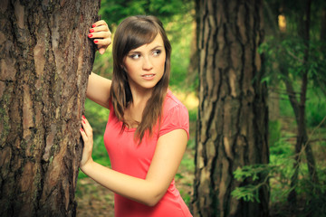 beautiful brunette in a forest