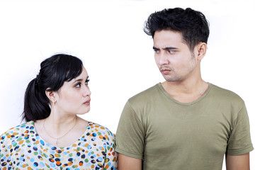 Close-up angry couple isolated on white