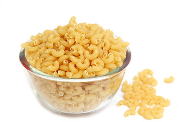 Macaroni in a glass bowl on white background