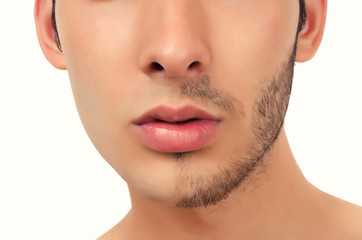 Portrait of a young beautiful man with half face shaved