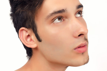 Naklejka premium Portrait of a young beautiful man with half face shaved