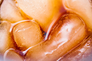 Cola glass with ice cubes