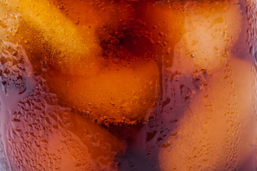 Cola glass with ice cubes