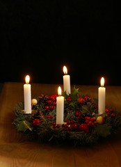 Advent wreath with silver ribbons.