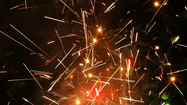 Large firework sparks burning at night fire show