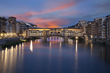 Fototapeta na wymiar Ponte Vecchio bridge at sunset. Florence, Italy