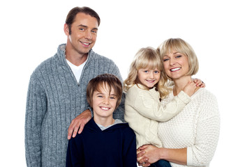 Fototapeta premium Portrait of friendly family of four in the studio