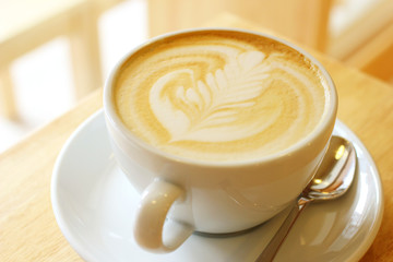 Cup of art latte or cappuccino coffee