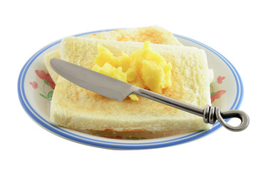 breakfast of bread with butter and knife