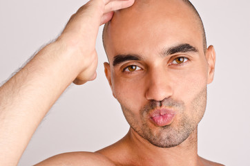 Obraz premium Man giving a kiss.Romantic funny man blowing a kiss.