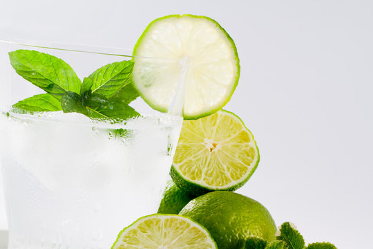 Limes, refreshing drink with ice