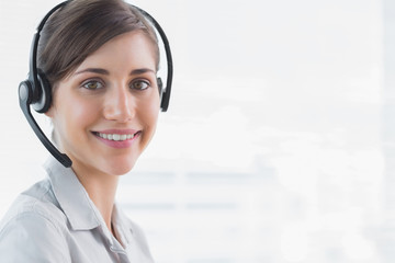 Call centre agent smiling at camera