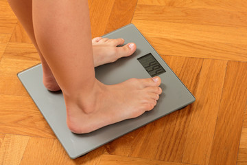 Feet on bathroom scale