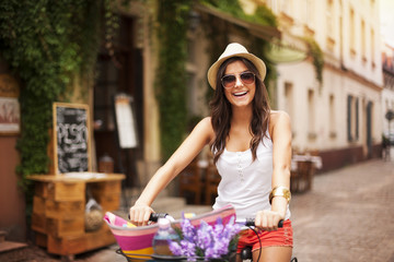 Beautiful woman riding on bike