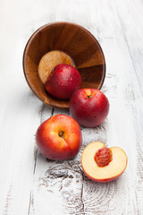 Fresh and tasty peaches on a table