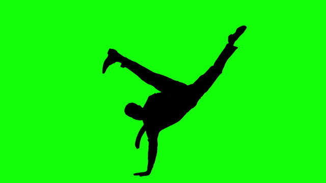 Silhouette of man with a tie breakdancing on green screen