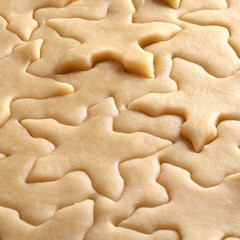 Pastry for Christmas cookies and snowflake shapes.