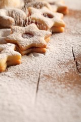 Christmas cookies and pouring sugar