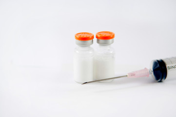 Orange cap vial and syringe