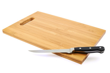 Steel kitchen knife on cutting board