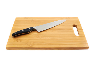 Steel kitchen knife on cutting board