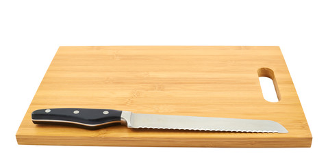 Steel kitchen knife on cutting board